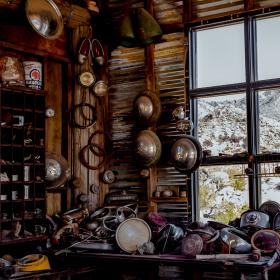 A picture of an old car through a window