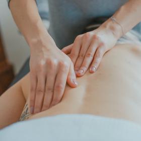 Person receiving a back massage